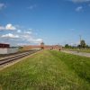 The Infamous Railway Tracks Leading Through The Gates Of Thwe Birkenau Death Camp - Near Krakow, Poland